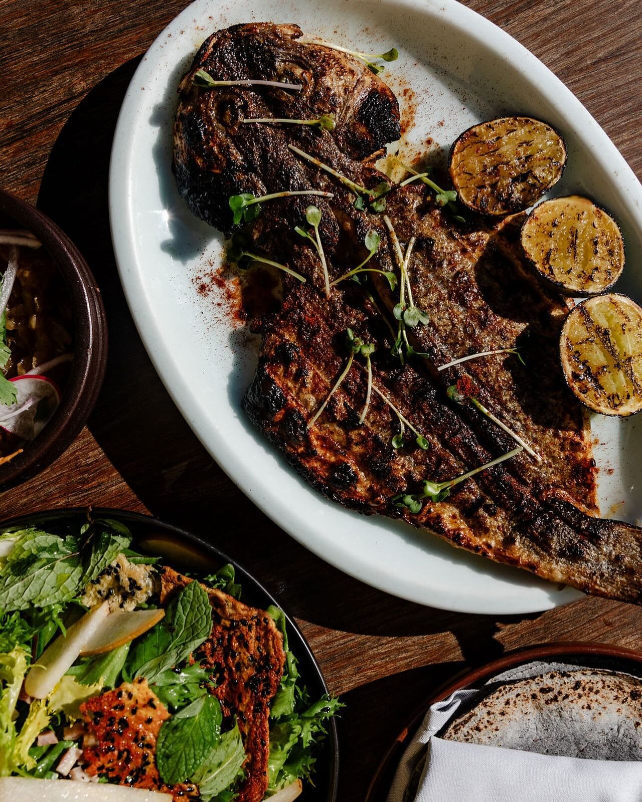 Branzino &ldquo;zarandeado,&rdquo; blue corn tortillas, calabrian chili mayo, and caramelized onions 🌮🌮 also, the black sesame frico on the salad! all for @dinela and only #dineLA #HLAYforever
full five-course menu online, every Dine LA reservatio